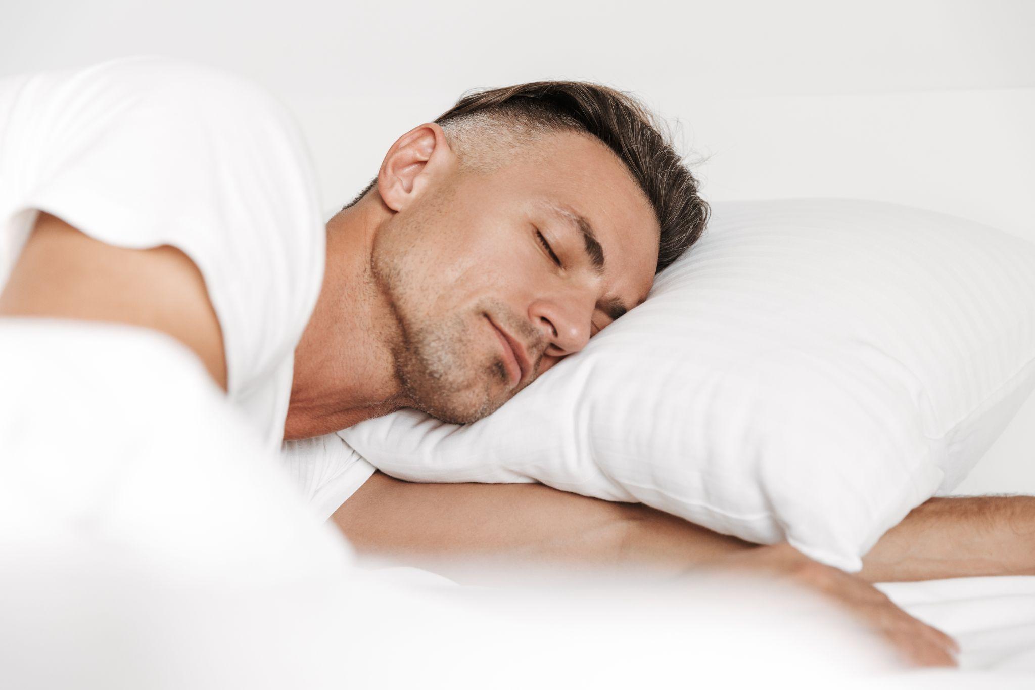 man sleeping, representing improved sleep quality after CPAP therapy