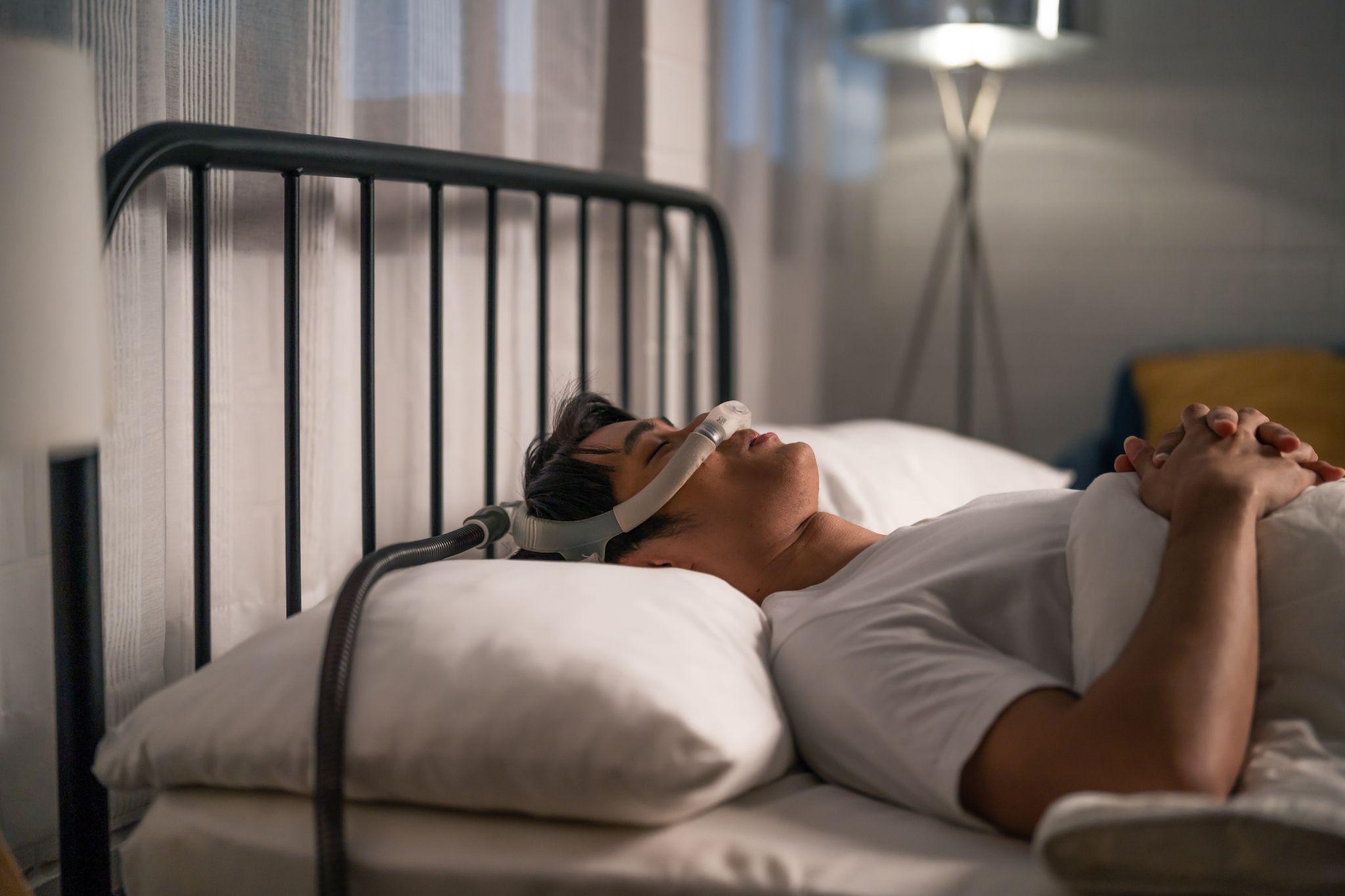 man using CPAP machine