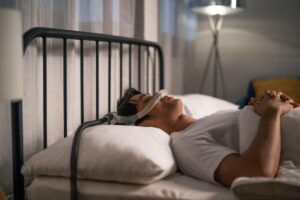 man using CPAP machine from a trusted CPAP machine provider in Harlingen, TX