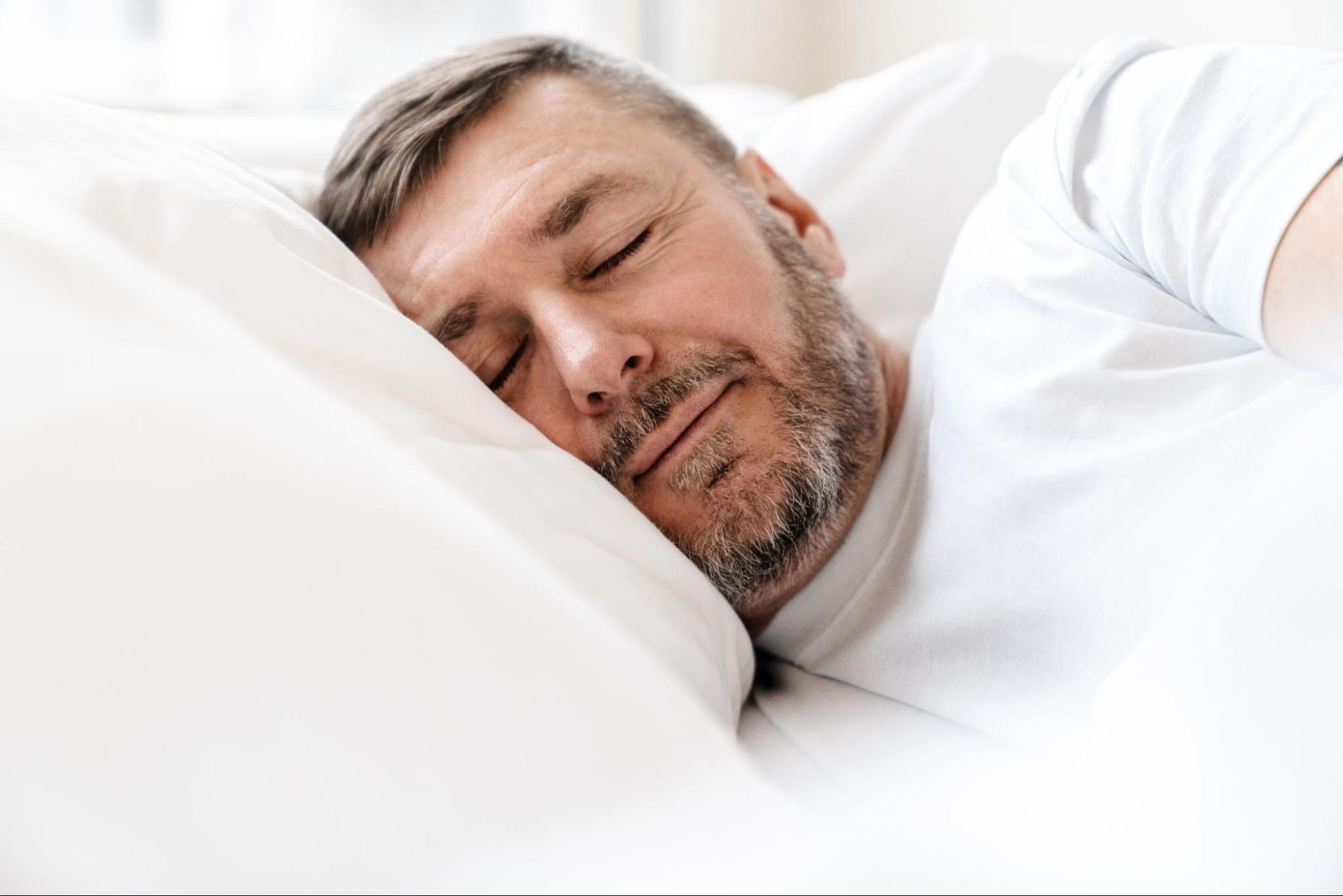Man sleeping comfortably after using Automatic CPAP (APAP) therapy.