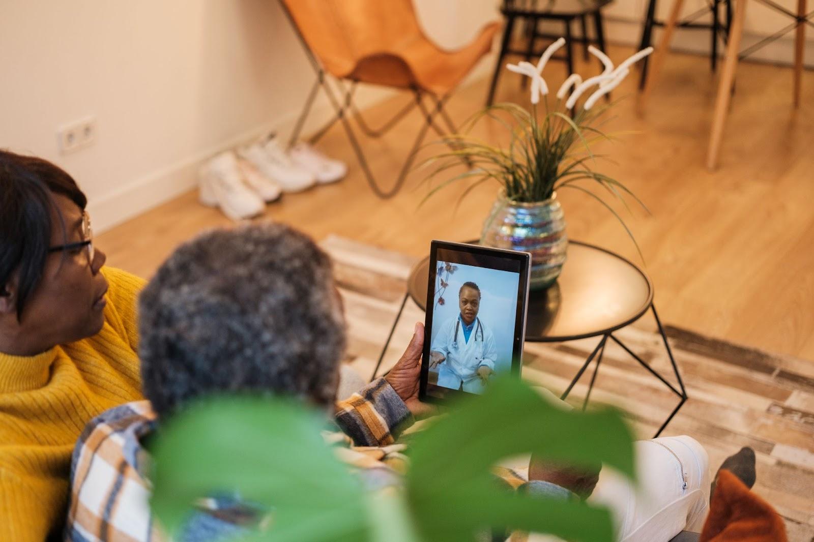 Patient consulting with a respiratory therapist via telehealth while coordinating with their pulmonologist