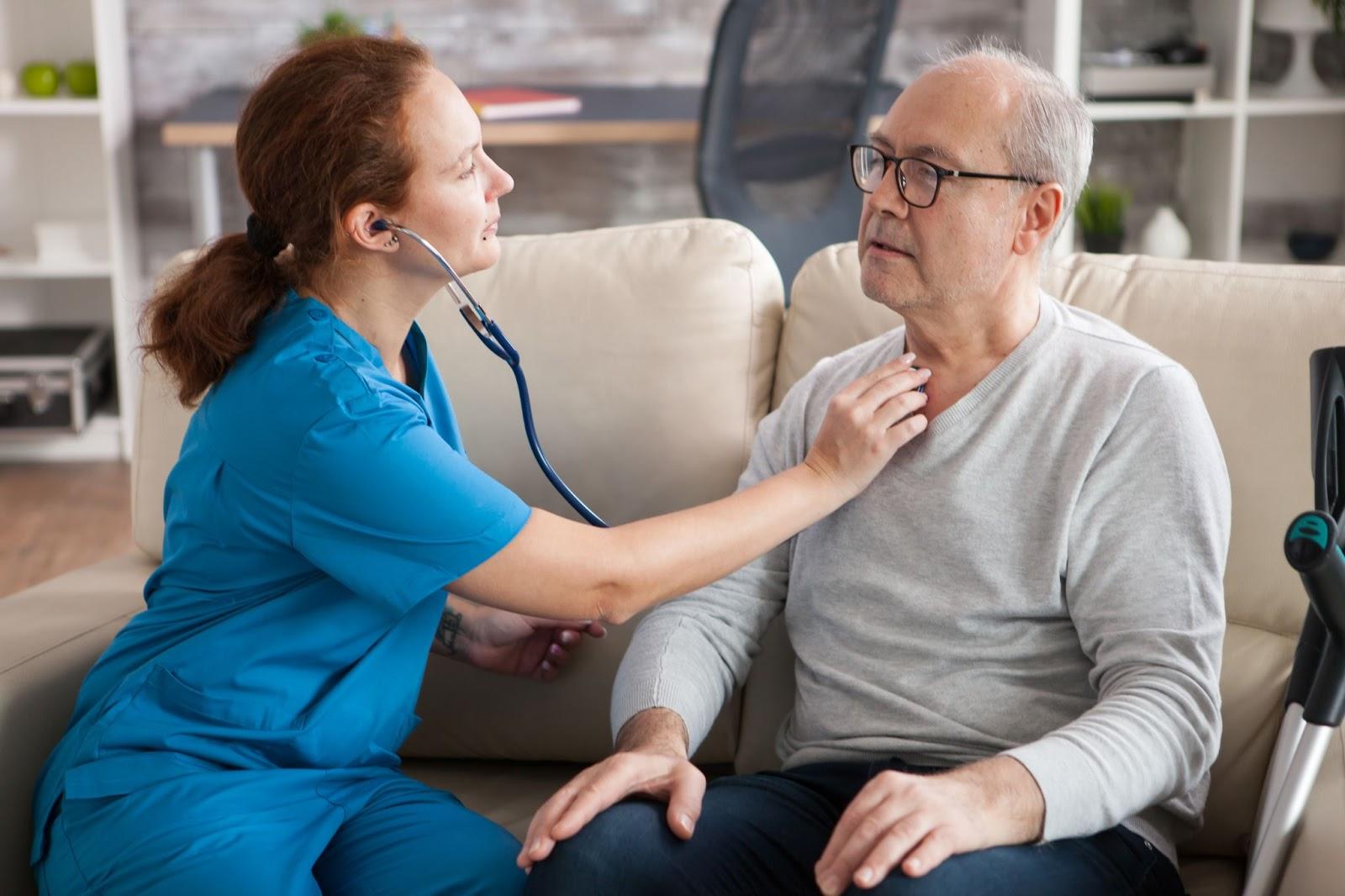 Licensed respiratory therapist delivering and setting up an oxygen concentrator at a patient’s home in South Texas