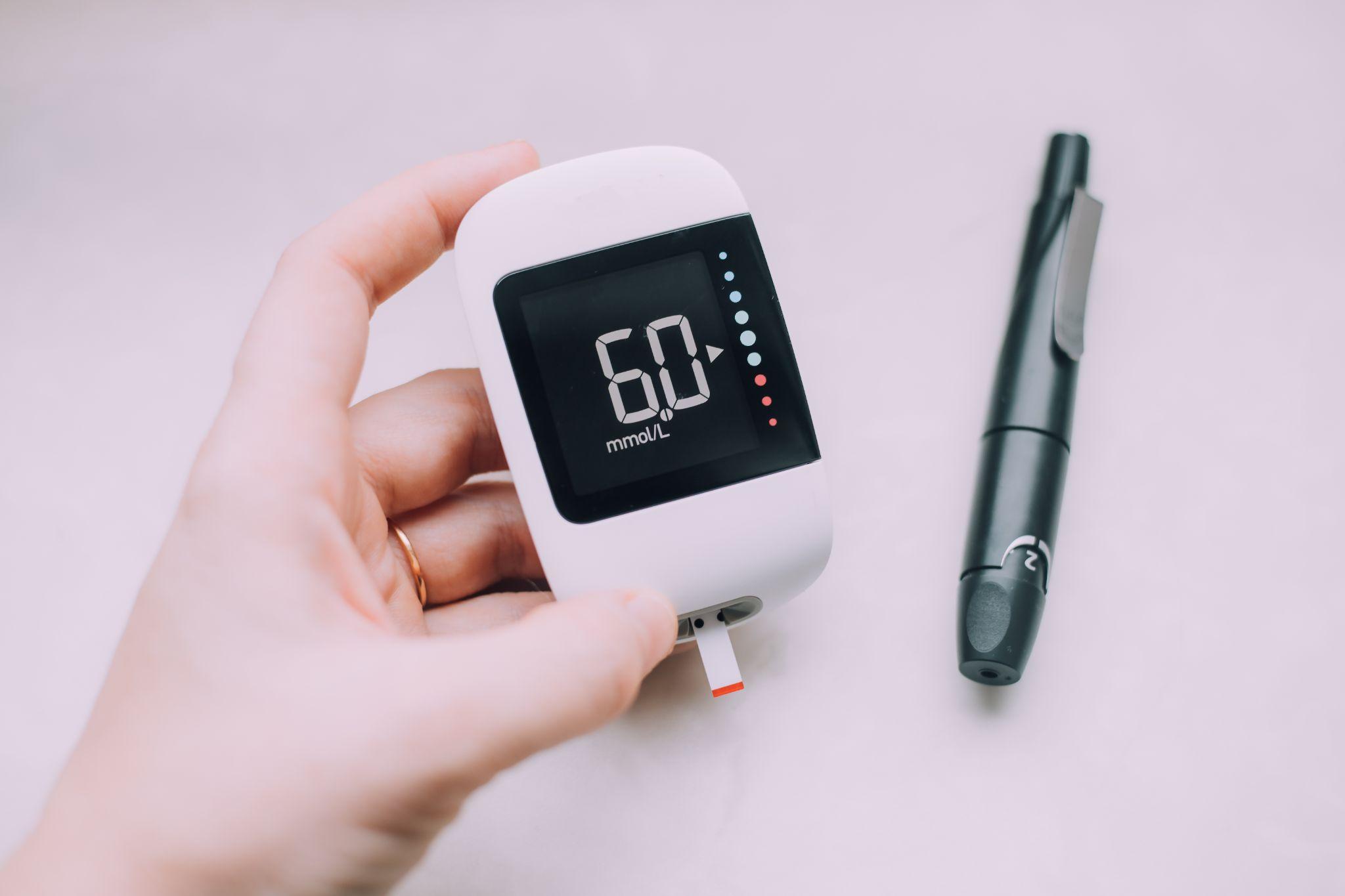 person using glucose monitor