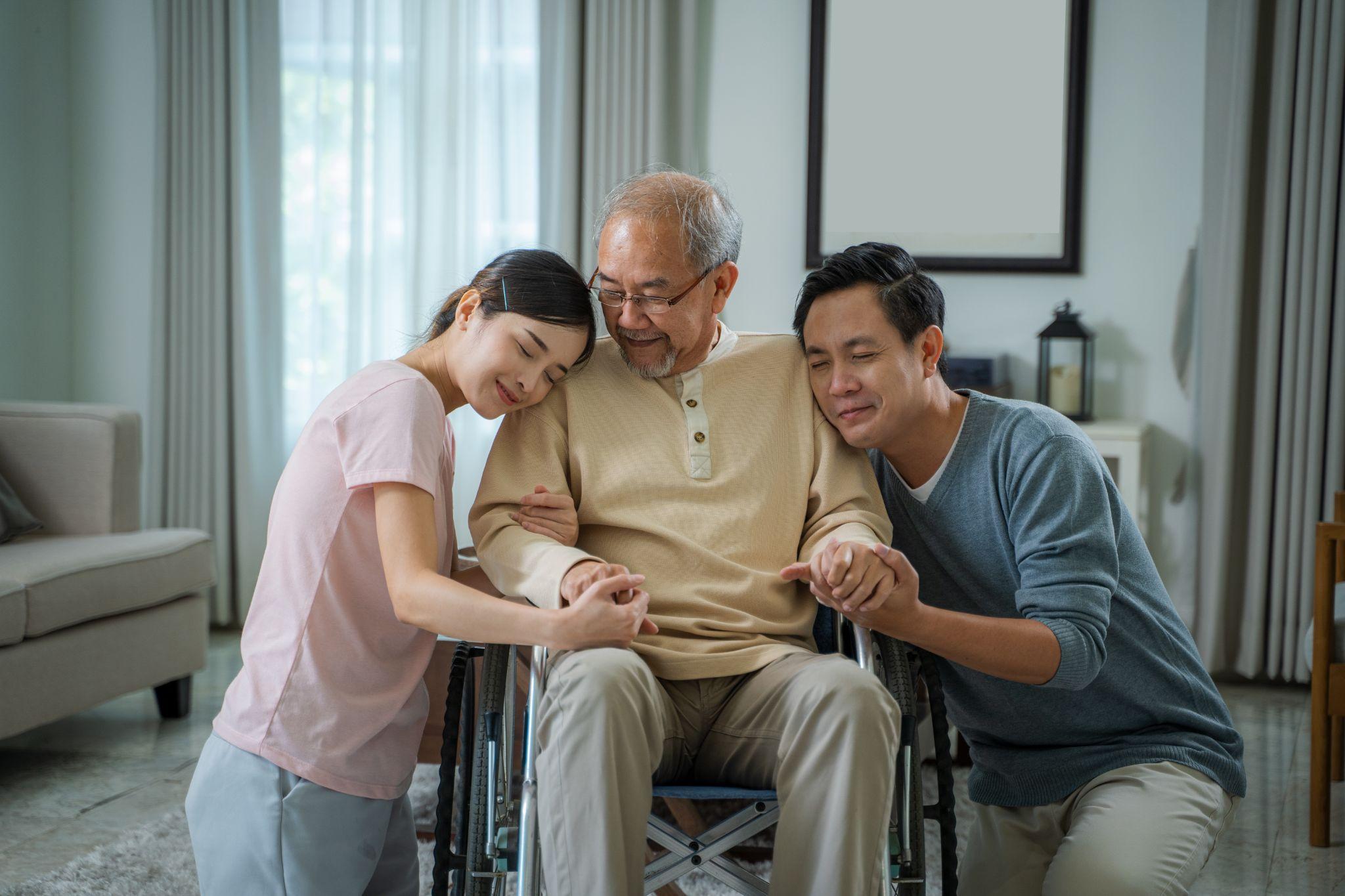 A family providing care for an elderly relative.