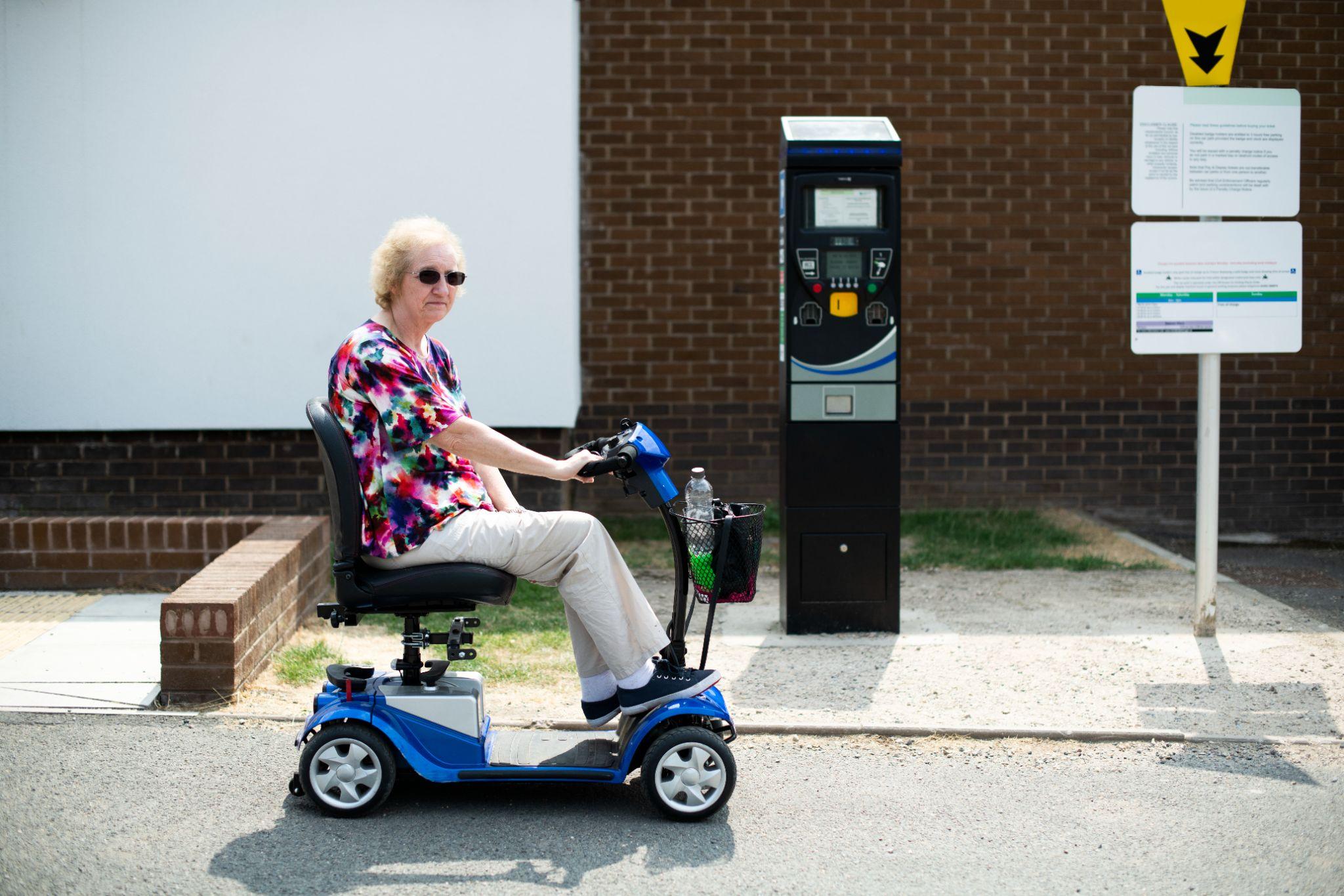 woman using mobility scooter