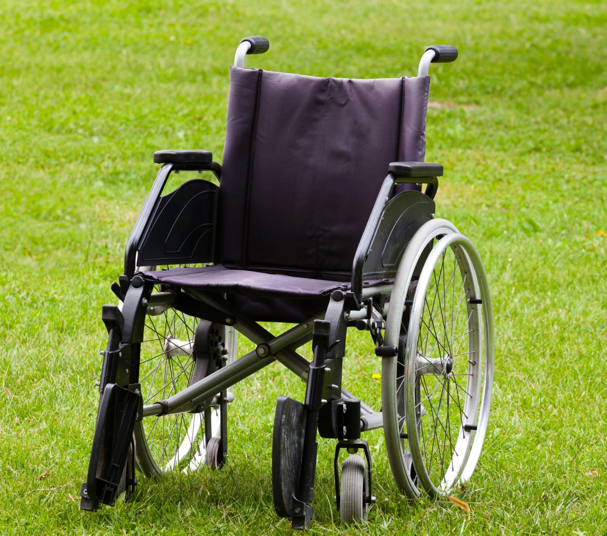 empty wheelchair on grass