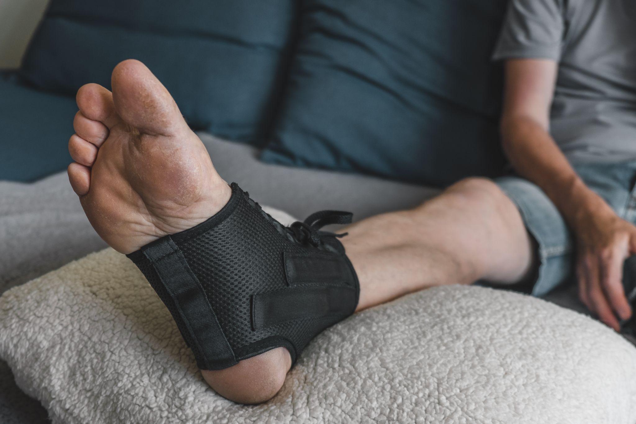 man wearing foot brace for support