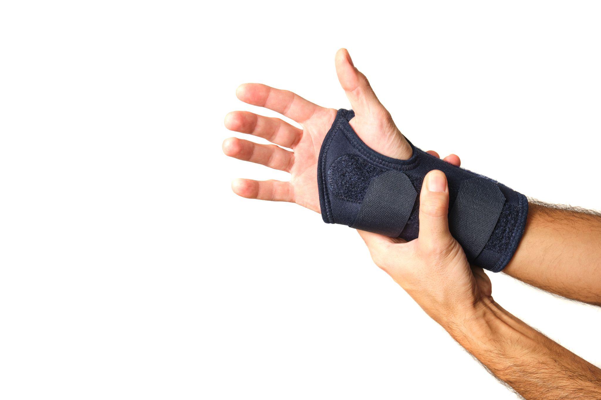 man holding wrist brace