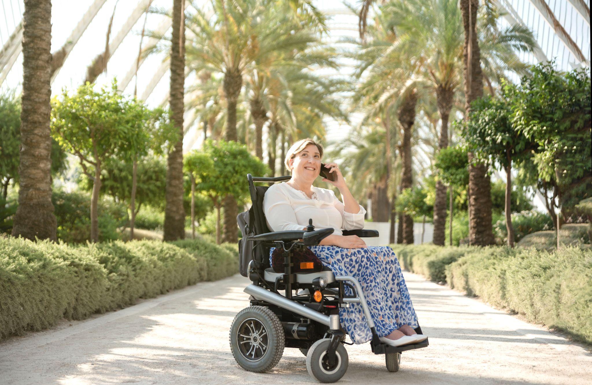 woman using a power wheelchair, representing the importance of mobility rehab solutions RGV