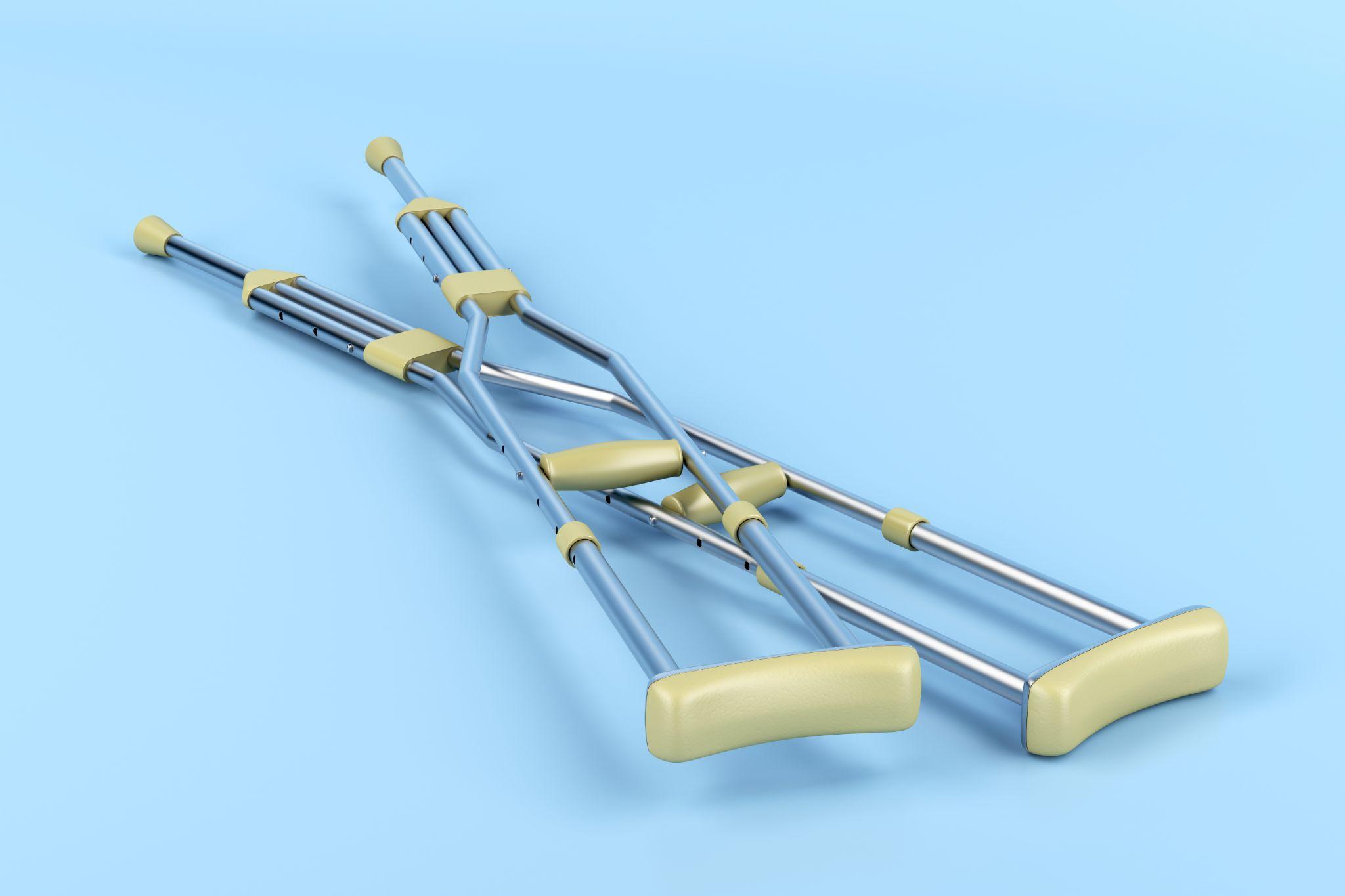 crutches against blue background