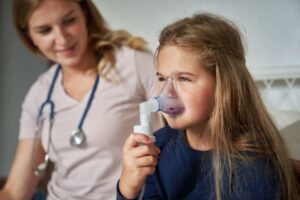 child using nebulizer, representing the need for a buying guide for medical supplies