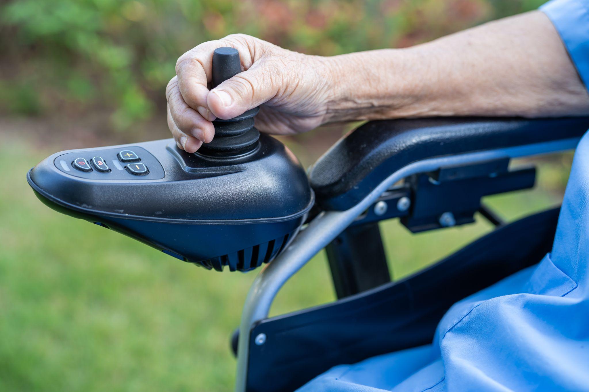 woman using a power wheelchair