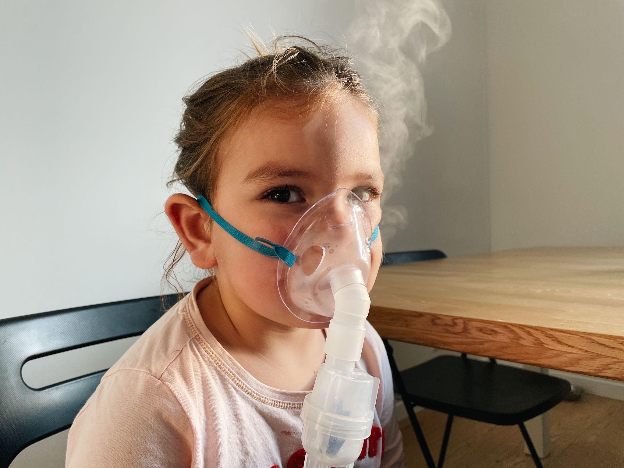 child using nebulizer