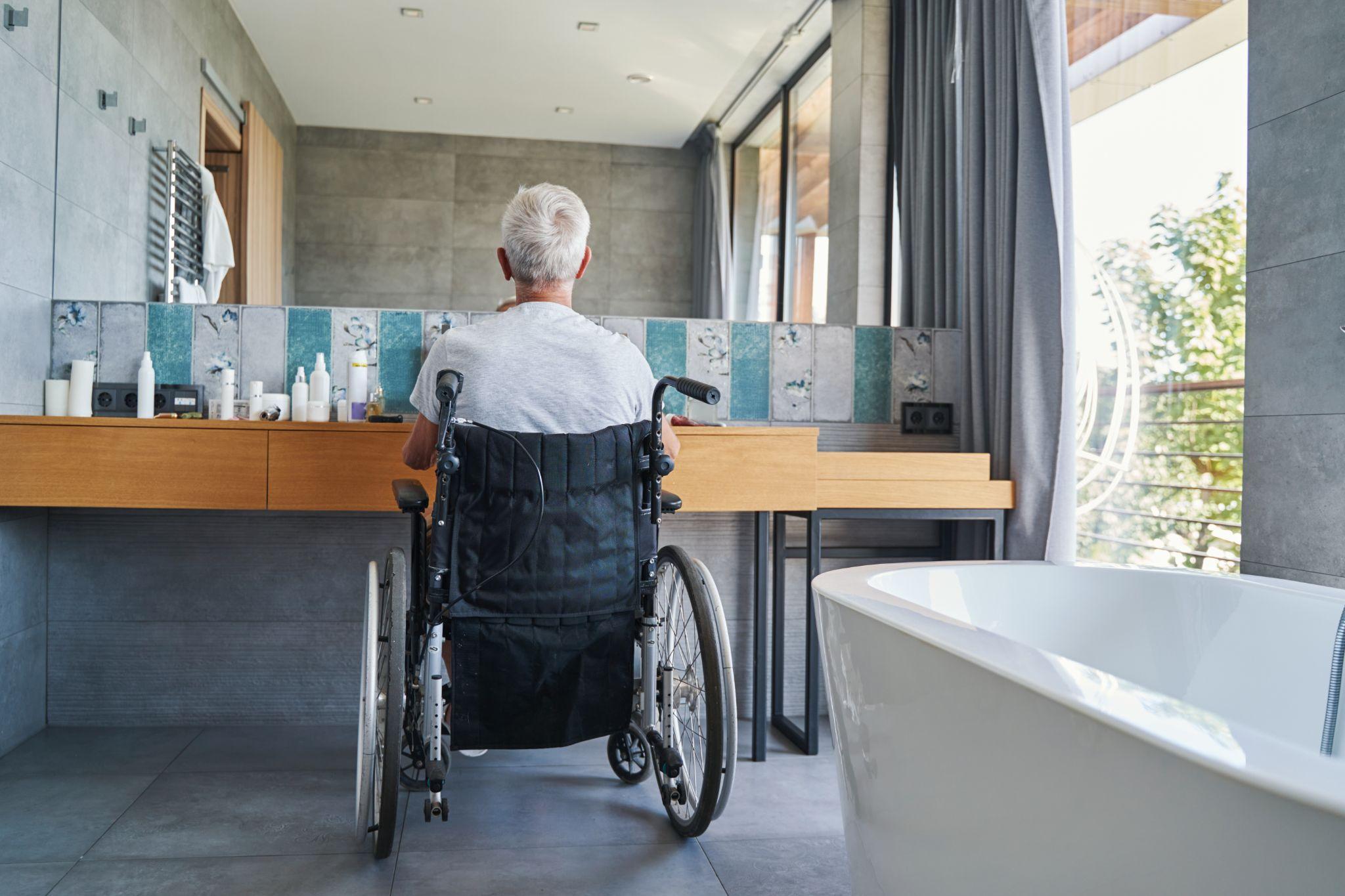 woman in bathroom while using wheelchair