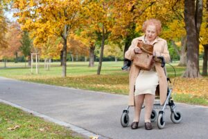 Senior woman using a walker outdoors, representing mobility equipment from a medical supply store near me.