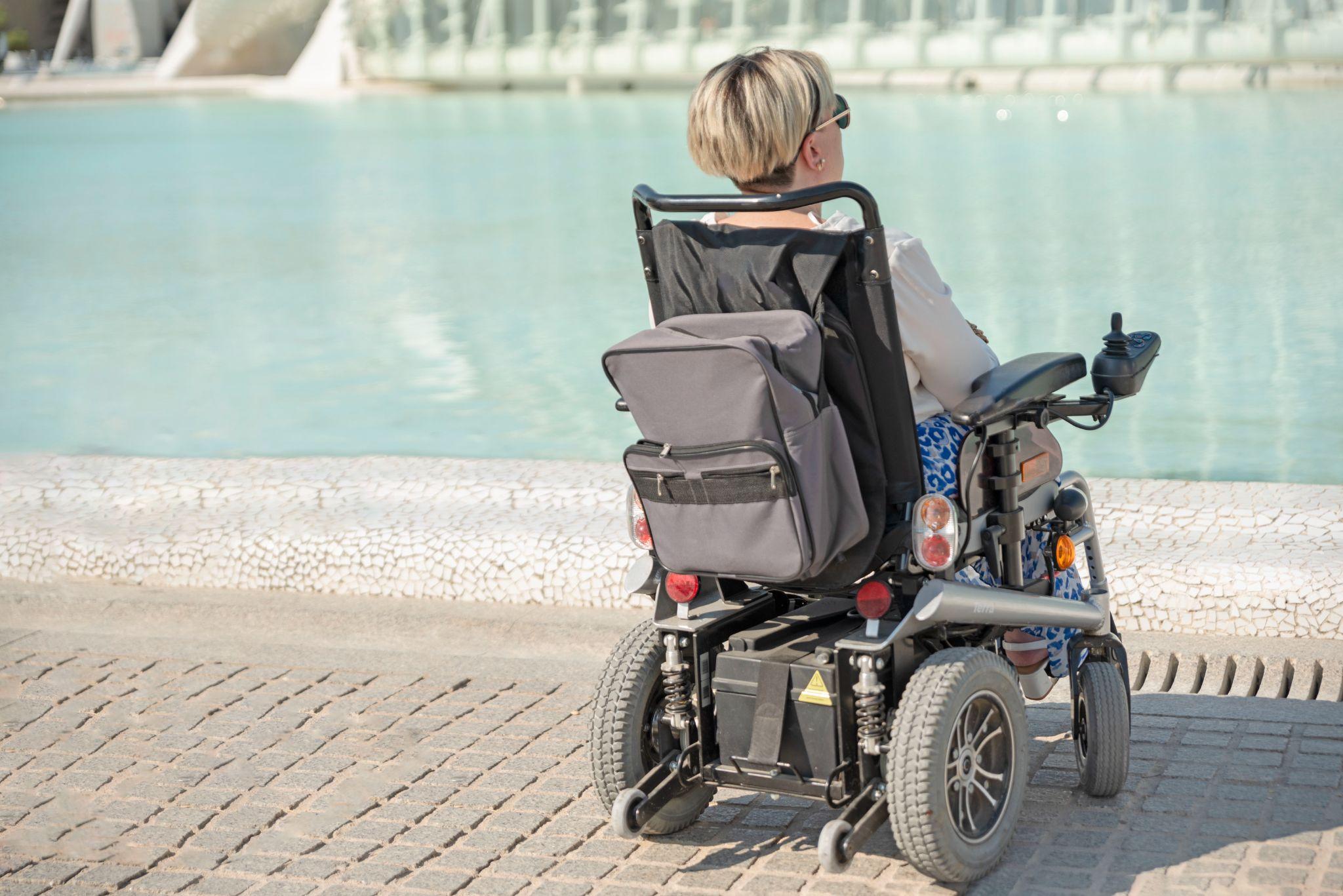 Person using a power wheelchair outdoors