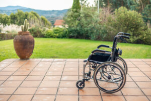 wheelchair next to a garden, representing the curiosity behind the question Does Medicare Cover Durable Medical Equipment