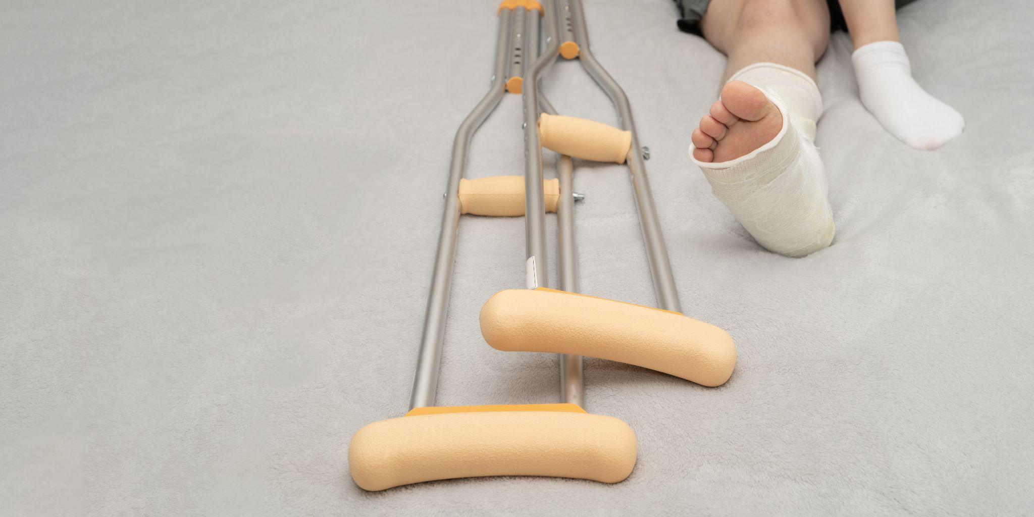Crutches beside injured foot