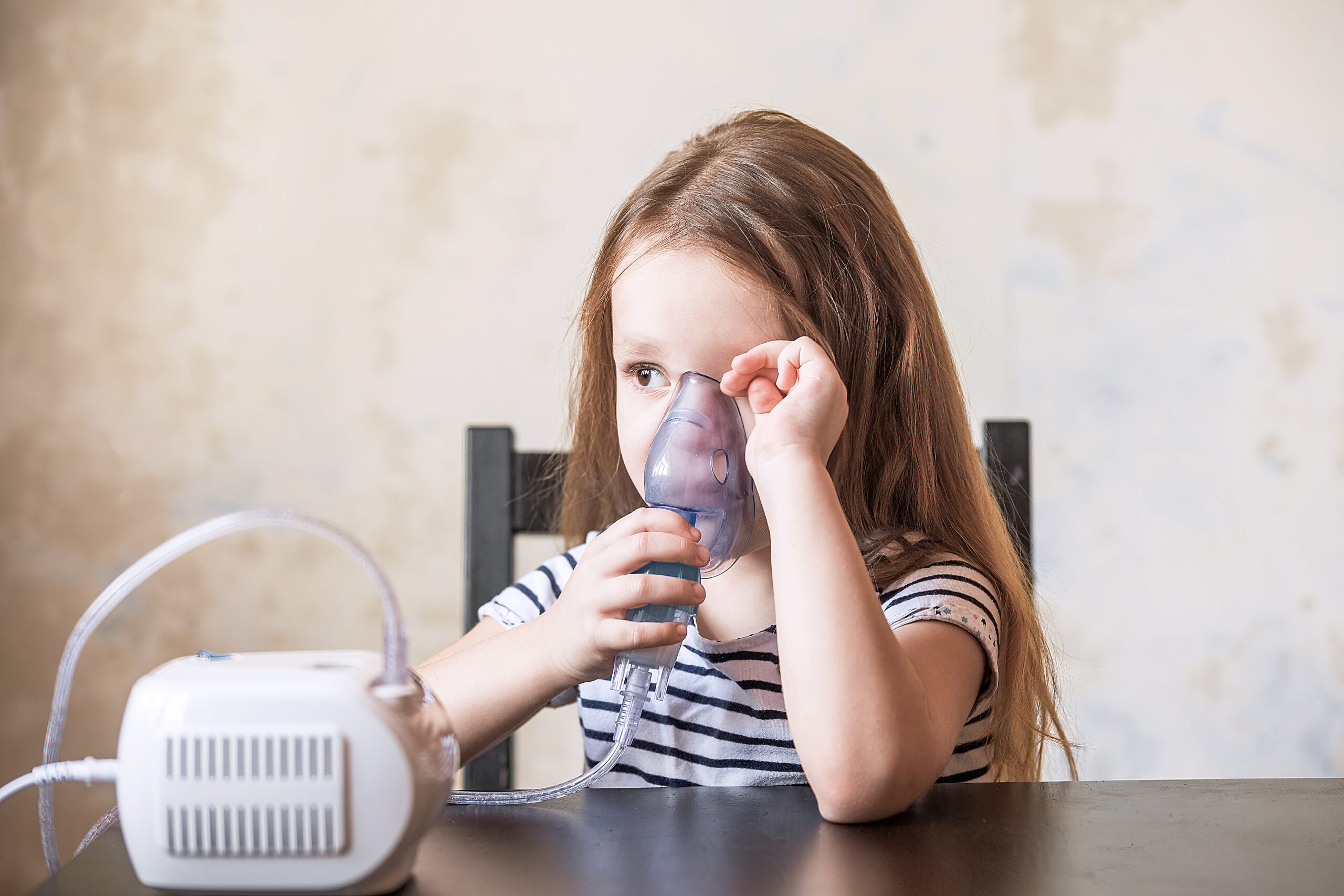 child using nebulizer
