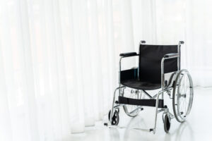 Empty wheelchair in hospital ward, an example of Medical Equipment Covered by Medicare in Harlingen