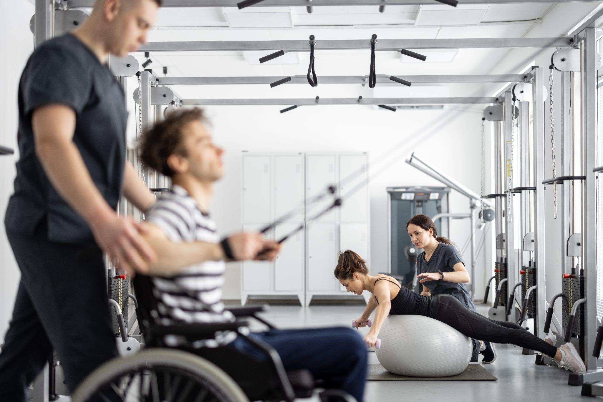 Patient using a wheelchair during a physical therapy session, showing how complex rehab equipment in Harlingen can support mobility and rehabilitation.