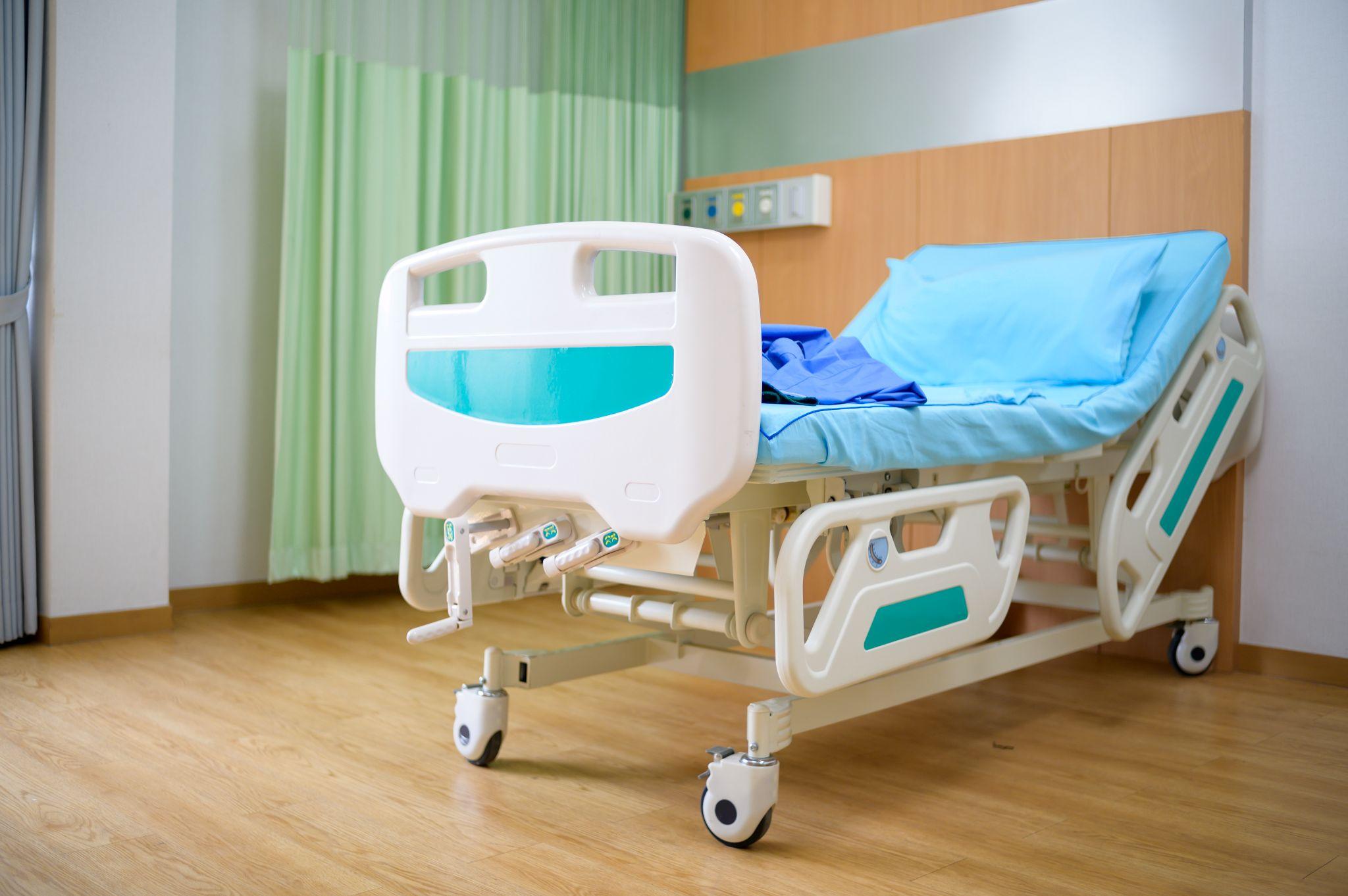 Adjustable hospital bed with raised head section for home medical care