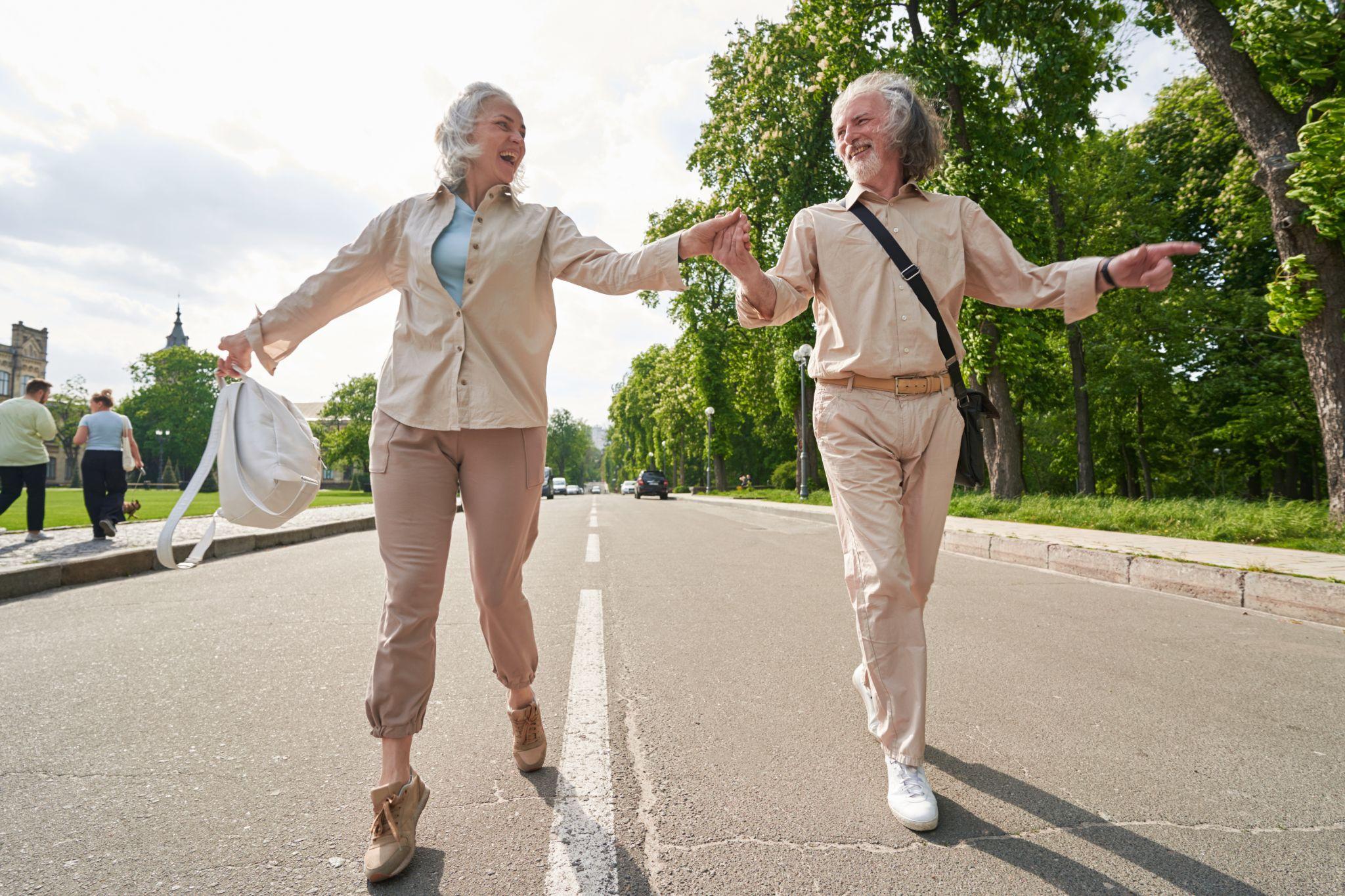 Senior couple walking comfortably outdoors with supportive footwear