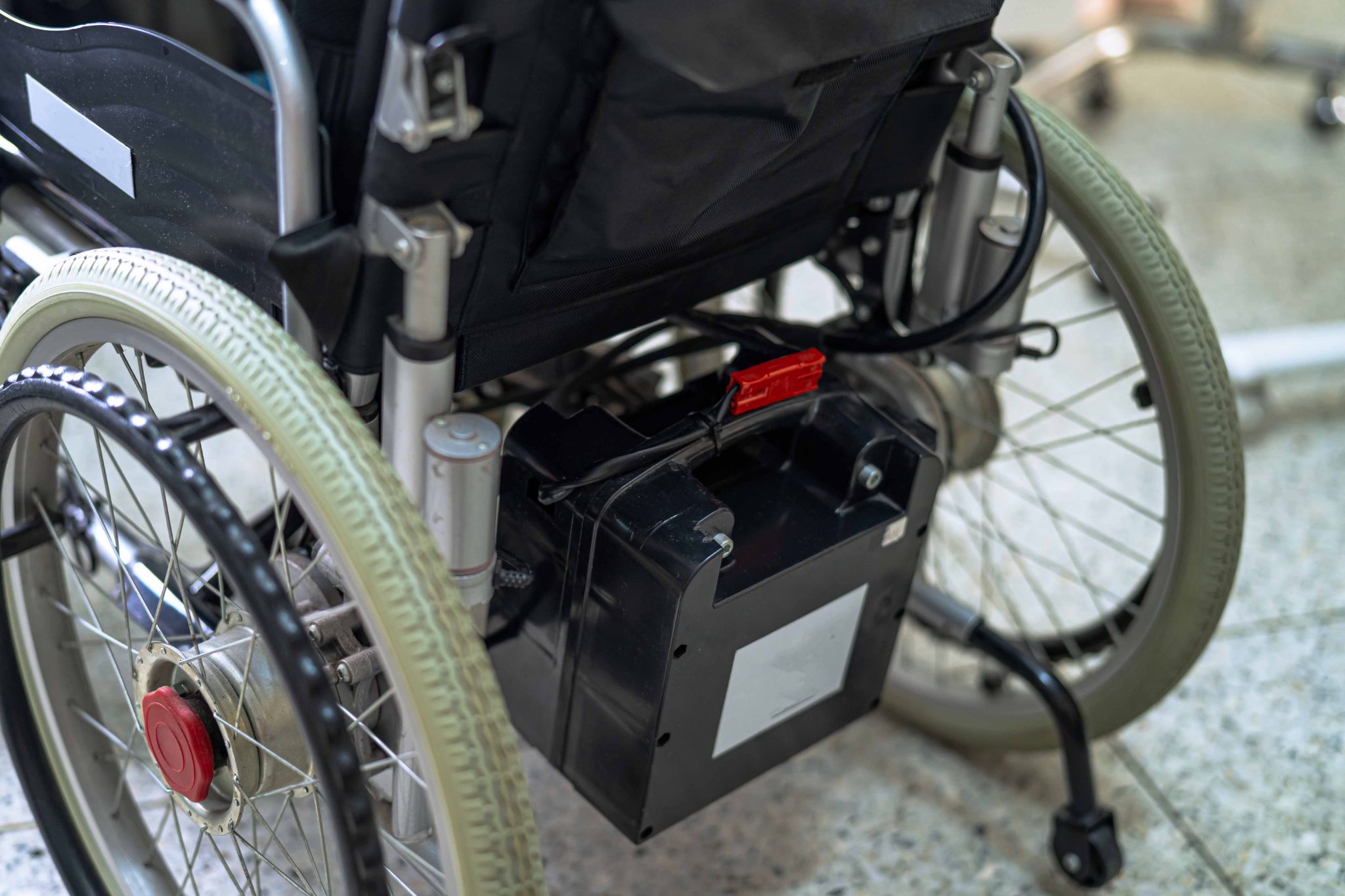 Battery pack installed on a powered wheelchair for everyday mobility
